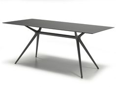 a black table sitting on top of a white floor next to a gray countertop