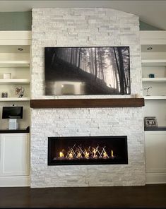 a fireplace with a tv above it in a living room