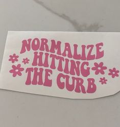 a sticker with the words normalize hitting the curb in pink on a white background