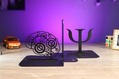 there are two metal sculptures on the table