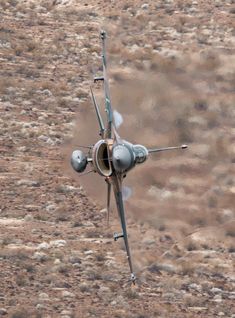 a fighter jet is flying through the air