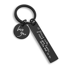 a black keychain with the words i love you written on it