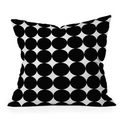 a black and white pillow with circles on it