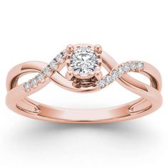 an 18k rose gold engagement ring with diamond accents