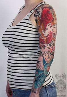 a woman with a tattoo on her arm