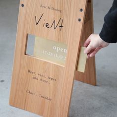 a person is opening a wine bottle box