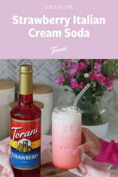 strawberry italian ice cream soda with strawberries in the background and text overlay that reads, strawberry italian ice cream soda