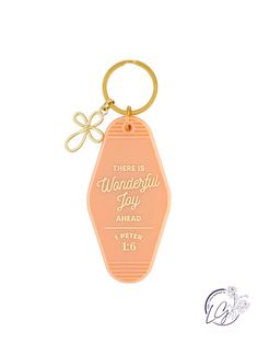 an orange keychain that says, there is wonderful joy ahead