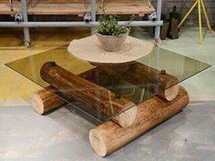 a table made out of wood and glass with a potted plant sitting on top