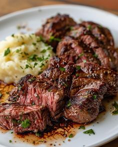 steak and mashed potatoes on a white plate