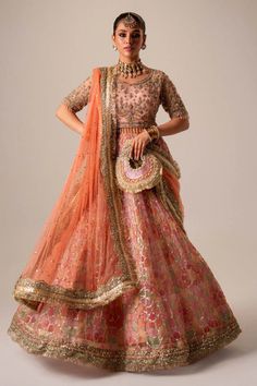 Premium Pakistani Bridal Dress in Organza Choli Lehenga Style is adorned with hand-crafted details of dabka, gota, kora, naqshi, and threads. The choli has an alluring pink shade and the Bridal Lehenga is multi-colored, creating a lavish Lehenga Dress for the bride to wear on the big day. Traditional Floor-length Dupatta For Reception, Designer Anarkali Choli For Transitional Season, Designer Wear Anarkali Style Choli For Transitional Season, Transitional Anarkali Choli With Dabka Work, Anarkali Choli With Dabka Work For Transitional Season, Traditional Saree Dress For Reception, Traditional Reception Gown With Dabka Work, Traditional Organza Sets For Reception, Traditional Organza Reception Sets