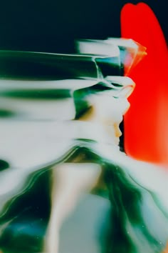 an abstract photograph of red and green vases