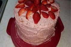 there is a cake with strawberries on it