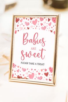 there is a sign that says babies are sweet please take a treat with hearts on it