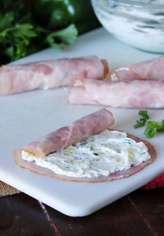 Rolling Up Pineapple Ham Roll-Ups Image Ham Cucumber Roll Up, Ham And Olive Roll Ups, Ham Rolls Ups, Easy Ham Roll Ups, Appetizer Recipes Roll Ups, Hye Rollers Recipe Tipsy Housewife, Keto Ham Roll Ups, Ham Rollups Appetizers, Appiterzers Easy Recipes Cold