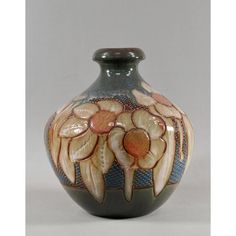 a vase with flowers painted on it