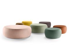 several different colored stools sitting next to each other