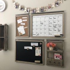 a bulletin board is attached to the wall with magnets and papers on it,