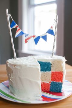 a cake with white frosting and red, white, and blue icing