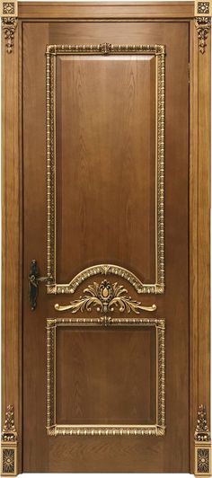 a wooden door with gold trimmings and an ornate design on the front panel