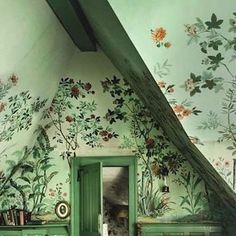 a room with painted walls and green furniture