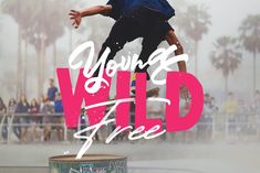 a man riding a skateboard on top of a metal barrel with the words young wild free above it