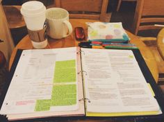 an open book sitting on top of a wooden table