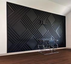 an artistic black and white room with a bike on the table in front of it