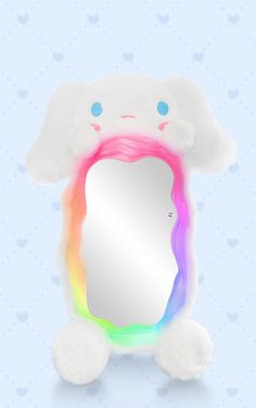 a white stuffed animal holding a rainbow colored mirror