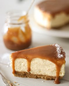 a piece of cheesecake on a plate with caramel sauce