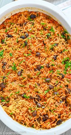 mexican rice and beans in a white casserole dish