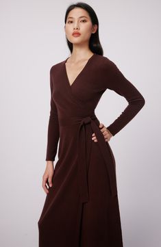 This quintessential wrap sweater-dress knit from luxe wool and cashmere features a sultry dipped neckline and waist-cinching sash. Surplice V-neck Long sleeves 70% wool, 30% cashmere Dry clean Imported Brown Fitted V-neck Wrap Dress, Elegant V-neck Cashmere Cardigan, Formal Fall V-neck Wrap Dress, Elegant Long Sleeve Cashmere Sweater Dress, Fitted Cashmere Sweater Dress For Fall, Chic Long Sleeve Wool Sweater Dress, Elegant Cashmere Sweater Dress For Winter, Elegant Cashmere Dresses, Elegant Cashmere Sweater Dress For Work