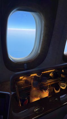 the inside of an airplane looking out at the ocean