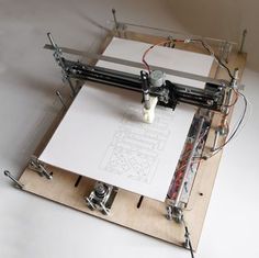 an image of a machine that is working on some kind of paper and wires in it