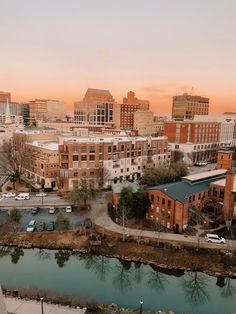 an aerial view of a city at sunset