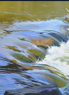 water flowing over rocks in a river