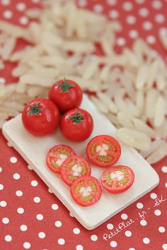 some tomatoes and pasta on a plate