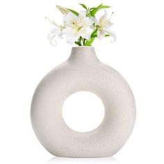 PRICES MAY VARY. Product advantages: weight: 2lbs, height: 9"; Right weight and size, modern minimalist design, pure ceramic production. Anti-breakage packaging. Decorative Matching: This donut vase is perfect for fresh flowers, dried flowers, buds, artificial flowers and plants, or with pampas grass and other decorative plants Decor options: Circle vase go great to entryway decor, living room table decor, mantle, farmhouse, shelf decor, corner table decor, endtable decor, rustic decor, boho tab Mantle Farmhouse, Circle Vase, Decor Corner, Boho Centerpiece, Pampas Grass Vase, Donut Vase, Nordic Boho, Minimalist Design Style, Farmhouse Shelf