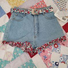 New With Tag Vintage 90s Shorts With Floral Trim & Removable Belt. Size 9 Juniors But Please See Measurements Waist 24 Inches Length 12 Inches 90s Style Levi's Bottoms For Spring, Levi's 90s Style Spring Bottoms, Retro Cutoff Shorts For Spring, Levi's Cotton Jean Shorts For Spring, Retro Denim Jean Shorts For Summer, 90s Levi's Denim Bottoms, Spring Retro Cutoff Shorts, Retro Style Medium Wash Shorts For Summer, Retro Medium Wash Shorts For Summer