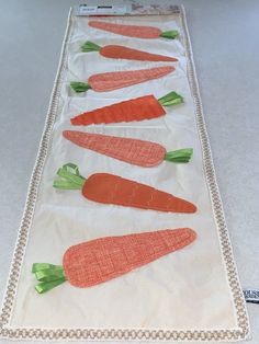 the carrots have been cut into small pieces and are on a piece of cloth