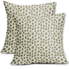 two pillows with green spots on them