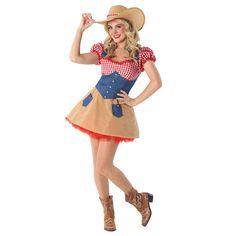 a woman in a cowboy outfit posing for the camera with her hands on her hips