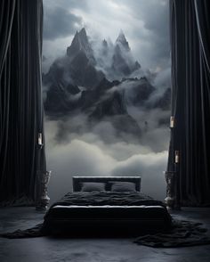 a bed sitting in front of a window covered in fog and clouds with mountains behind it