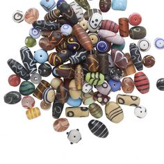 a pile of colorful glass beads sitting on top of each other