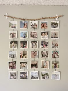 a bunch of pictures hanging on a wall with clothes pins attached to the pegs