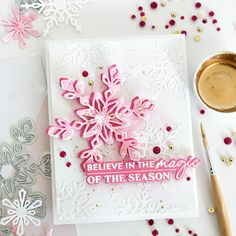 a snowflake card with the words believe in the magic of the season