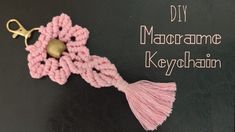 a crocheted keychain with a tassel hanging from it