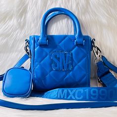 This Listing Is For A Brand New With Tags 100% Authentic Unique Steve Madden Bbabi Satchel / Crossbody / Shoulder Bag With Removable Air Pod Case. Includes Detachable Air Pod Pouch , Dual Carry Handles, Thin Detachable Shoulder Strap, Thick Detachable Logo Shoulder Strap ( 3 Different Ways To Wear It) Measures Approximately : 6.52" (L) X 6" (H) X 2" (D) Top Flap Snap Closure One Interior Zip Pocket Steve Madden Sunglasses, Steve Madden Backpack, Steve Madden Wallet, Air Pod, Quilted Totes, Red And Black Plaid, Crossbody Shoulder Bag