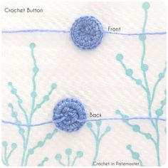 two crocheted blue flowers sitting on top of a white surface with the words crochet button front and back