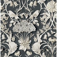 an intricately designed wallpaper with white flowers and birds on grey background, in the style of paper cutouts